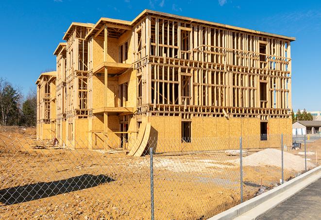 a close-up of temporary chain link fences enclosing a job site, signaling progress in the project's development in Cape Canaveral FL